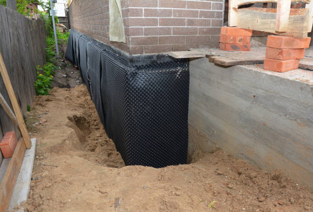 Happy homeowners after waterproofing job in Hayden